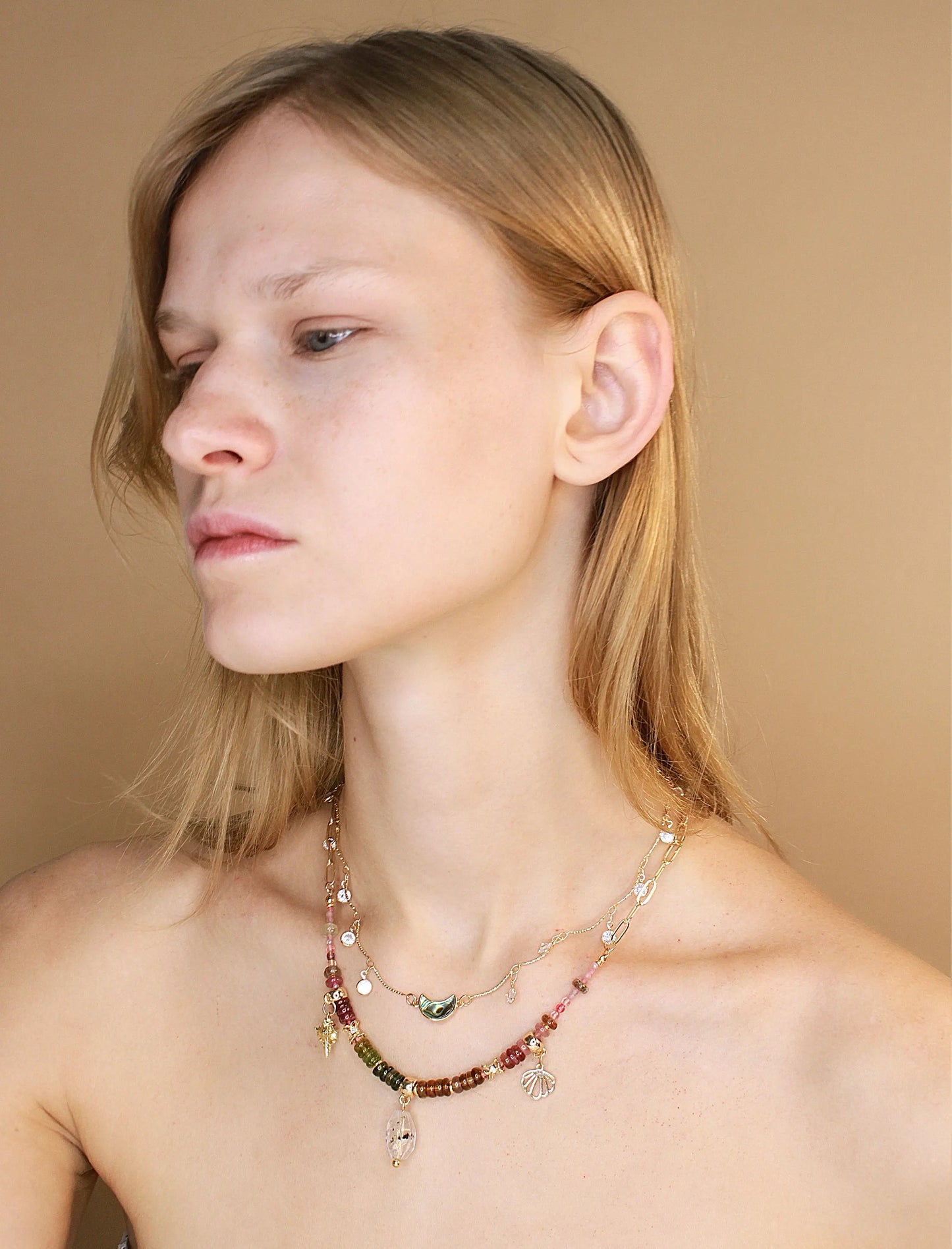 Woman wearing Herkimer diamond and tourmaline stone necklace