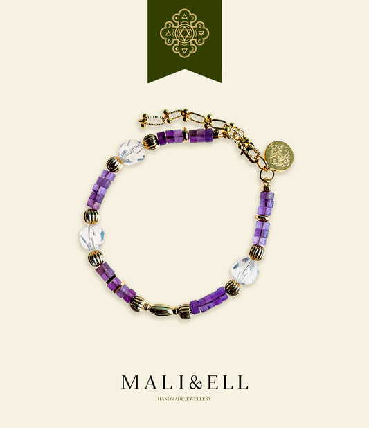 Purple beaded bracelet with gold accents on a beige background, featuring the brand 'MALI&ELL'.